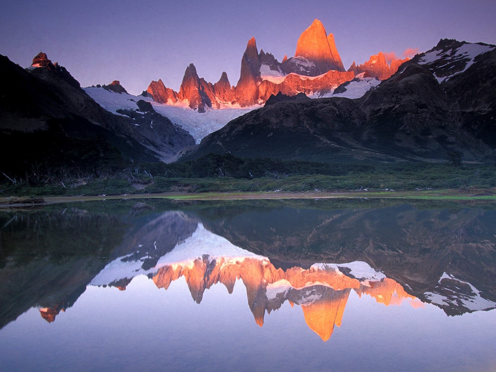 Snow-capped Mount Fitz Roy at sunrise, reflected in the lake, El Chaltén, Argentine Patagonia